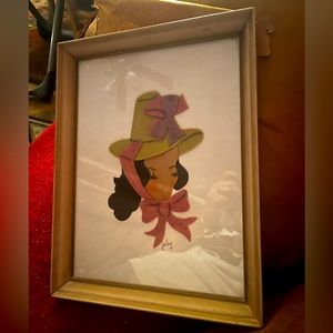 Vintage 1960’s artwork created with material. Painted face. So unique